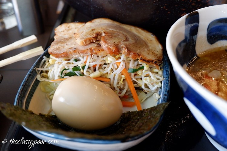 Marutoku Tsukemen is served with Aji-tama (Japanese egg), Nori and Pork Tonkutsu broth.